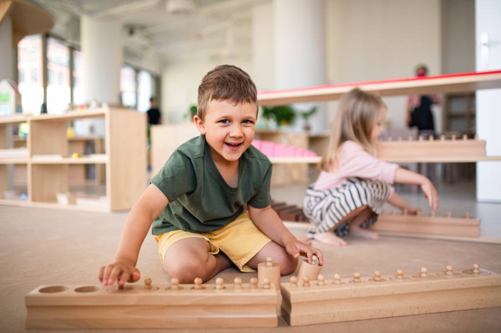 A child working at a Montessori shelf